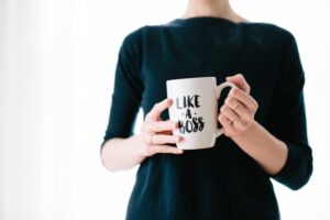business owner holding liek a boss mug